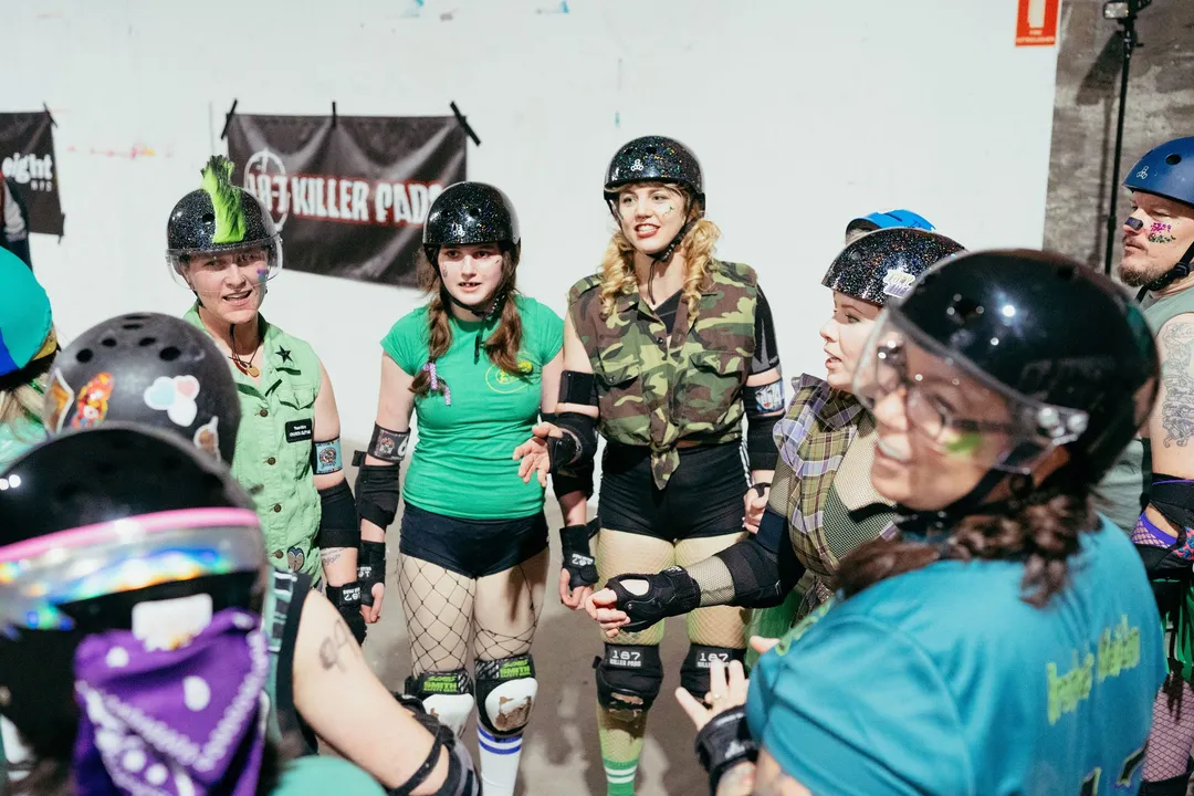 Skaters line up together before the bout