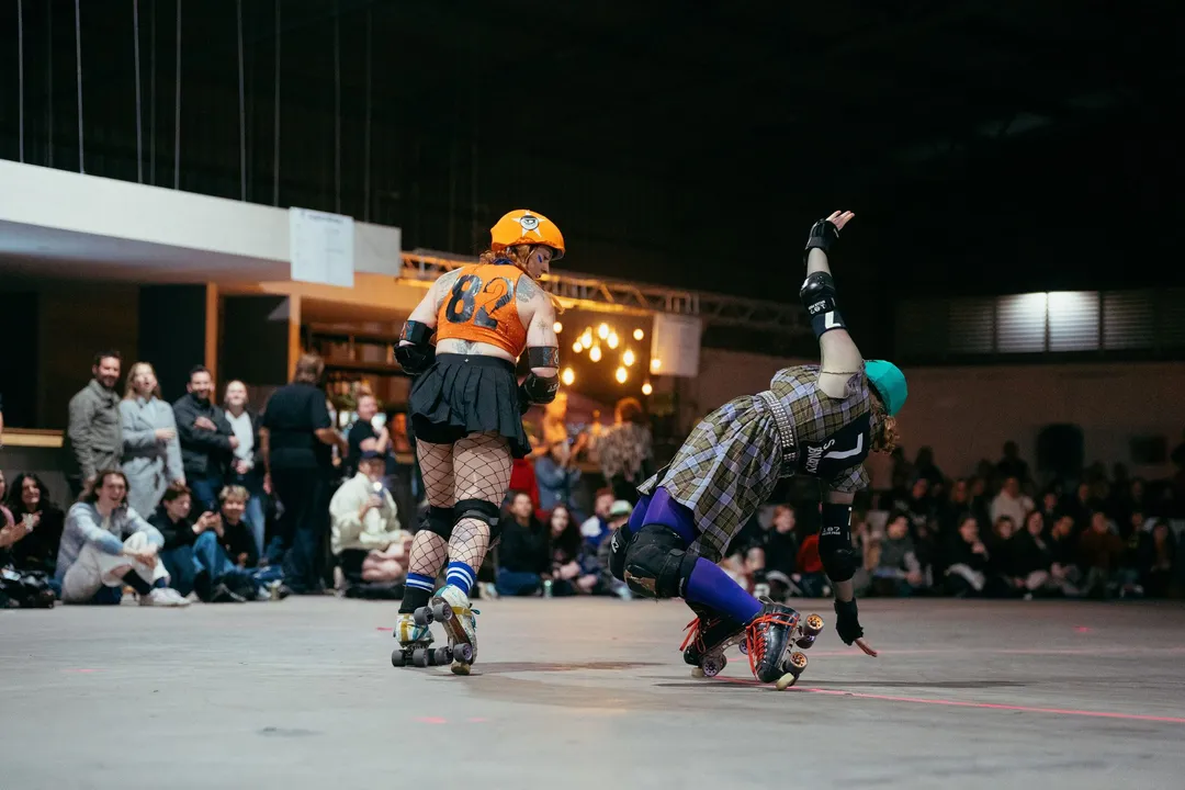 A blocker sends a skater to the floor