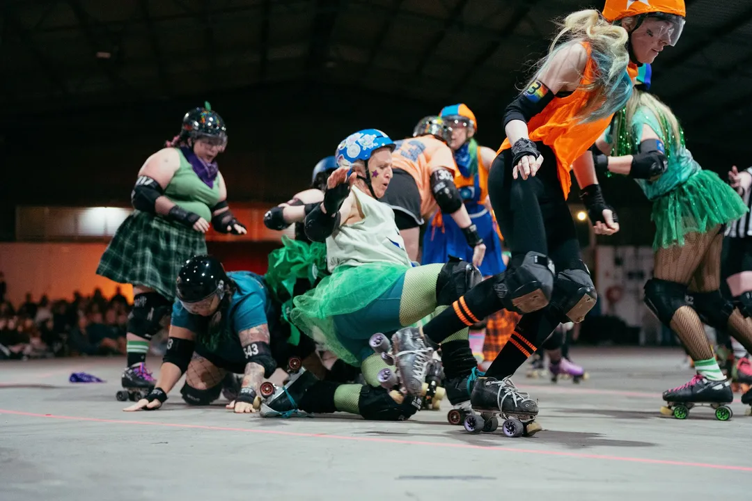The pack goes down in a tangle of tulle and skates