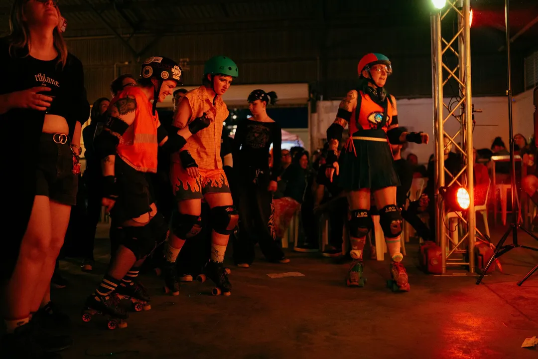 Skaters gather at the stage as the band starts
